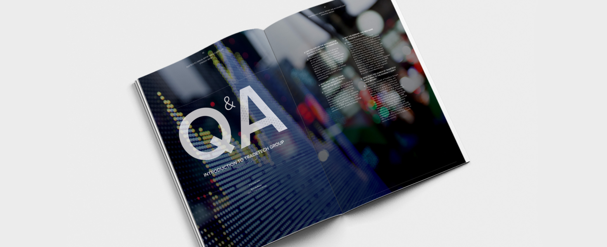 An image of an annual report laying open showing a graphic with the word: Q&A