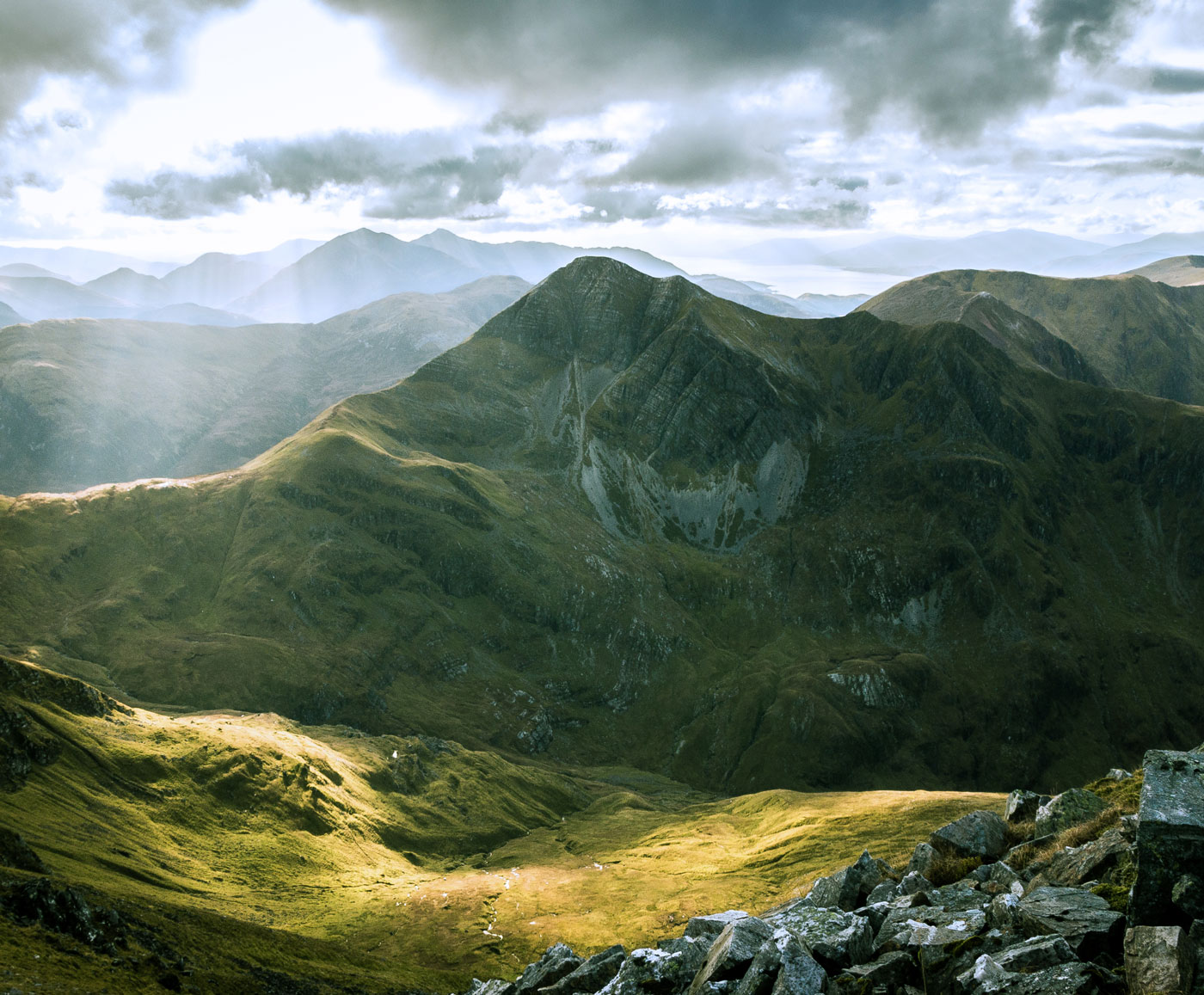 A landscape shot of a mountain range in the sunshine